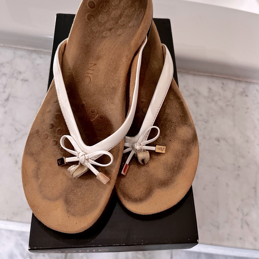 Used Good Condition-White Vionic Flip Flops (see photos for wear)